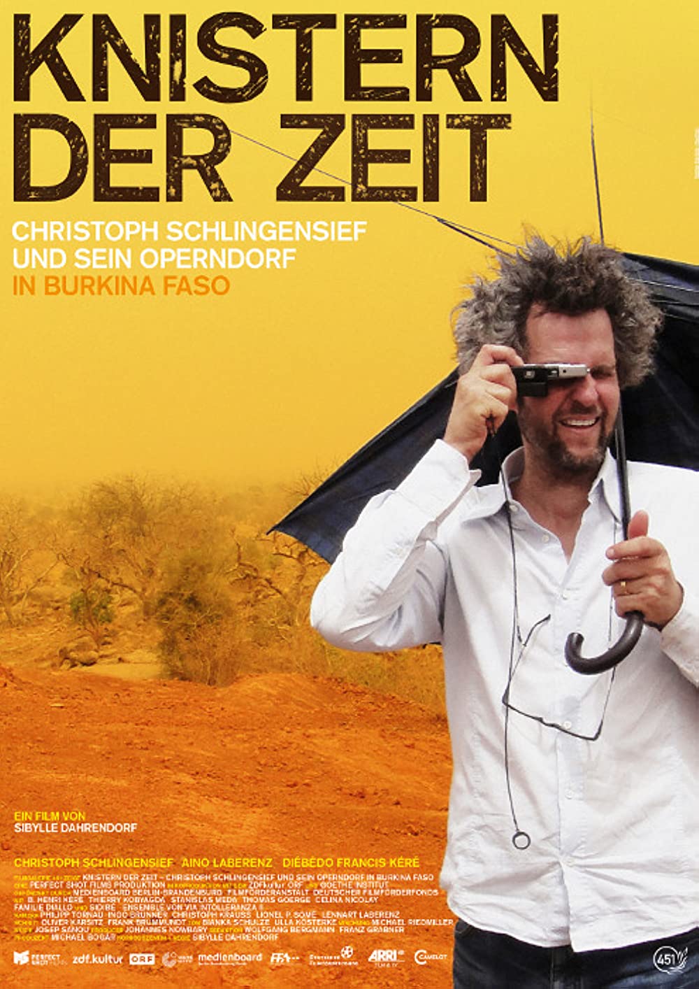 Filmbeschreibung zu Knistern der Zeit - Christoph Schlingensief und sein Operndorf in Burkina Faso